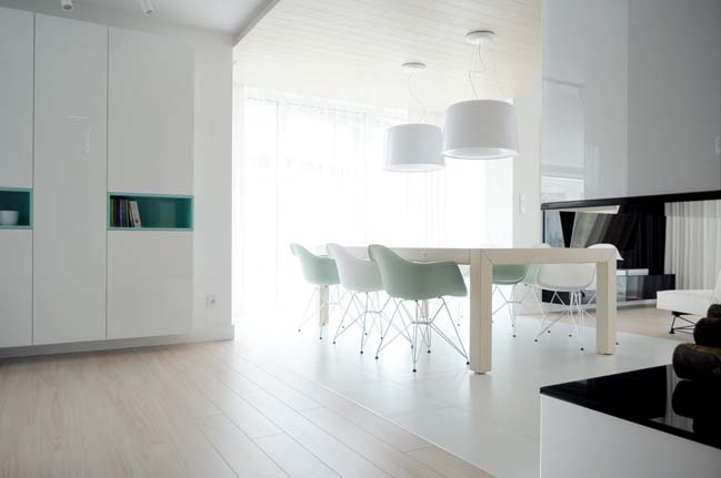 Modern apartment with combination of white and wood