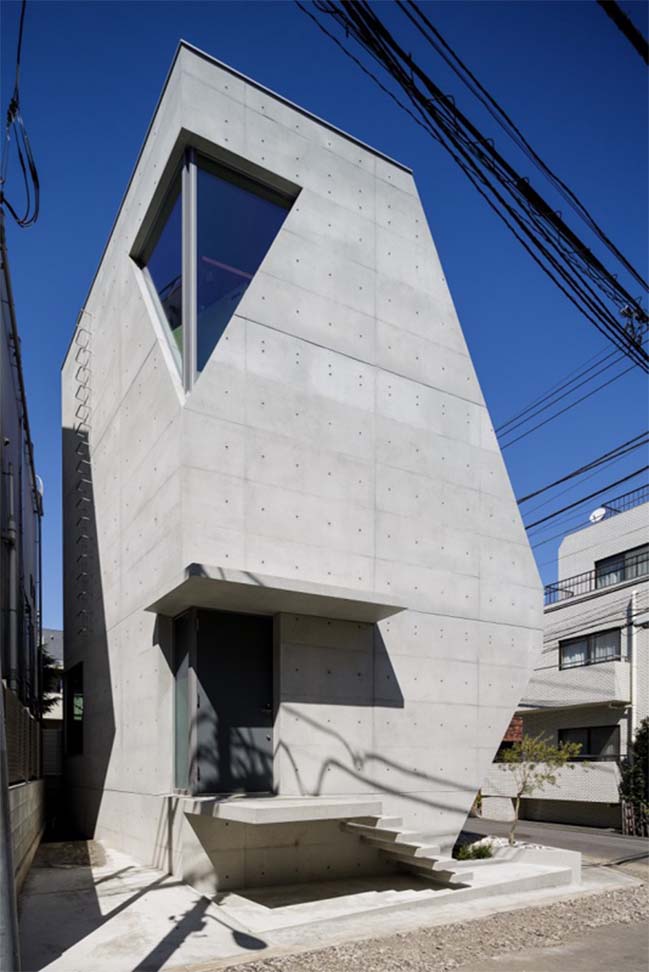 Concrete townhouse with unique futuristic architecture