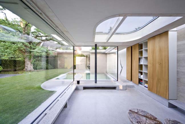 Concrete villa with glass walls by De Bever Architecten