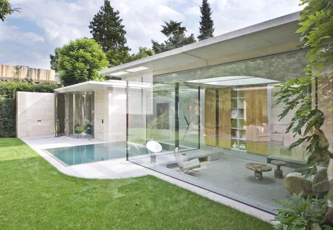 Concrete villa with glass walls by De Bever Architecten