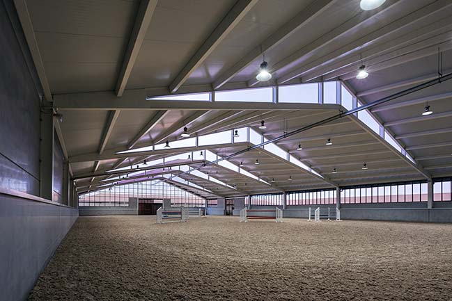 Horse Riding Field in Cattle Farm by OOIIO Architecture