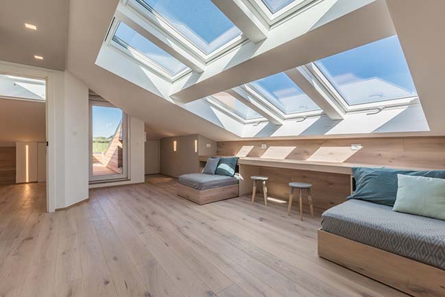 Attic renovation with skylights opening by BIONDI Architetti