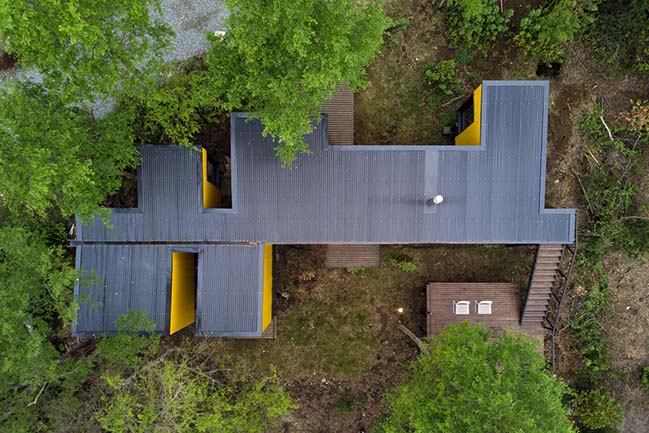 Yellow House in Pucon by Alejandro Soffia
