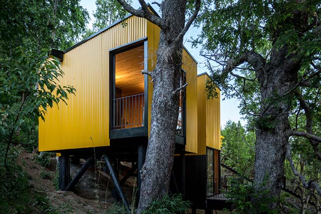 Yellow House in Pucon by Alejandro Soffia