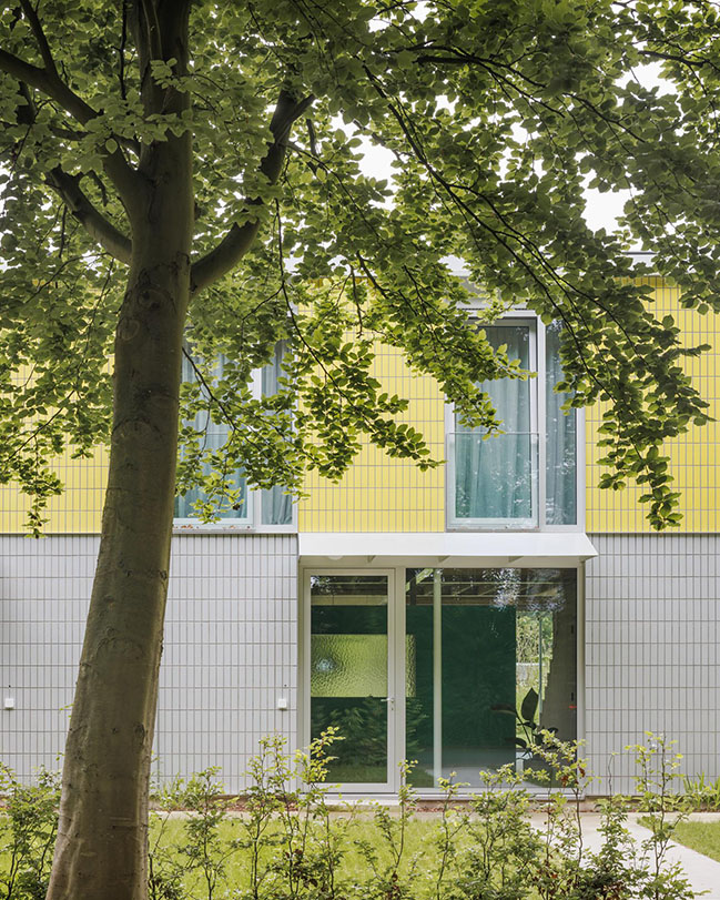 House + Workshop by studio MOTO | Sustainable Design with Harmonious Yellow Tile Facade