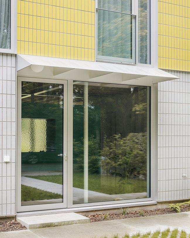 House + Workshop by studio MOTO | Sustainable Design with Harmonious Yellow Tile Facade