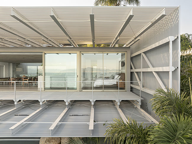 Ponte House by TETRO | Harmonious Coastal Residence on Cacupé Sea with Bridge and Stone Accents