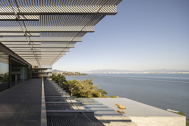 Ponte House by TETRO | Harmonious Coastal Residence on Cacupé Sea with Bridge and Stone Accents