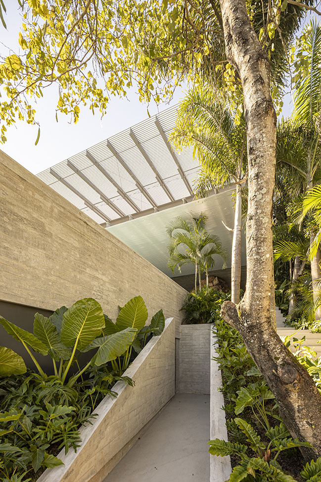 Ponte House by TETRO | Harmonious Coastal Residence on Cacupé Sea with Bridge and Stone Accents