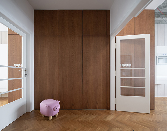 Functionalist Apartment with Pink Piggy by Martin Cenek Architecture