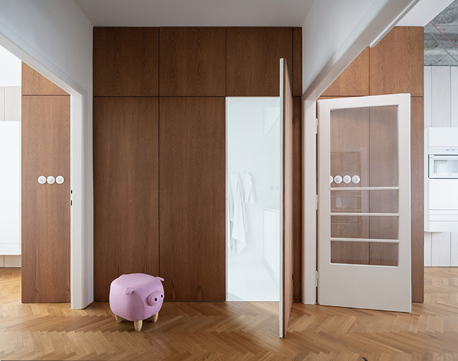 Functionalist Apartment with Pink Piggy by Martin Cenek Architecture