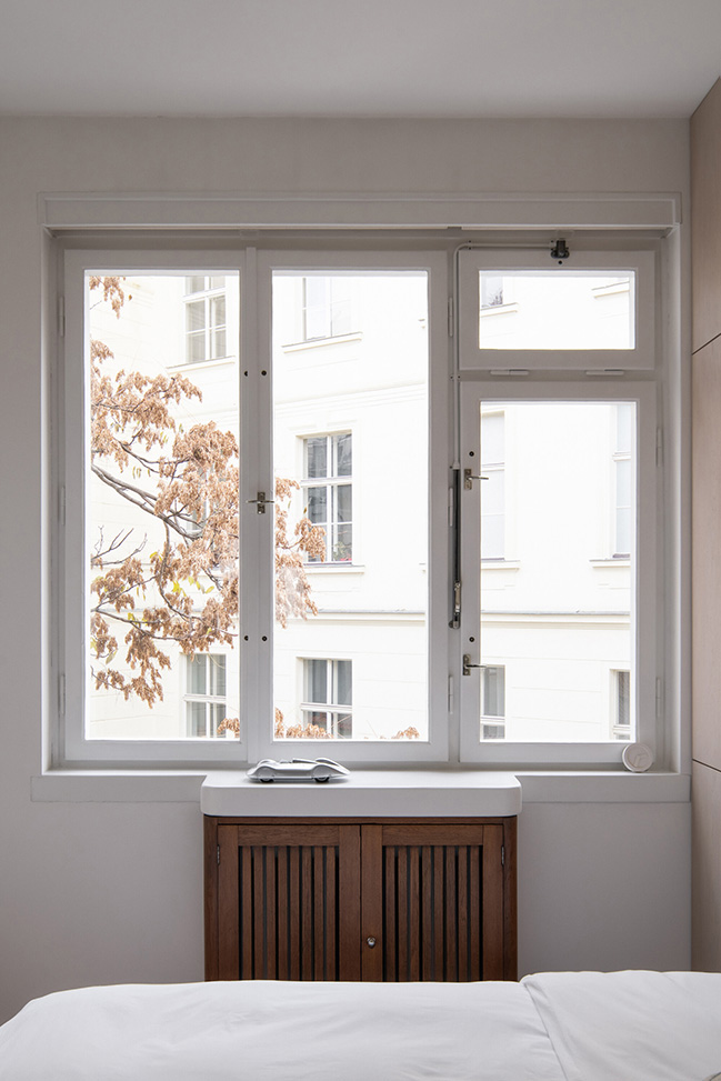 Functionalist Apartment with Pink Piggy by Martin Cenek Architecture