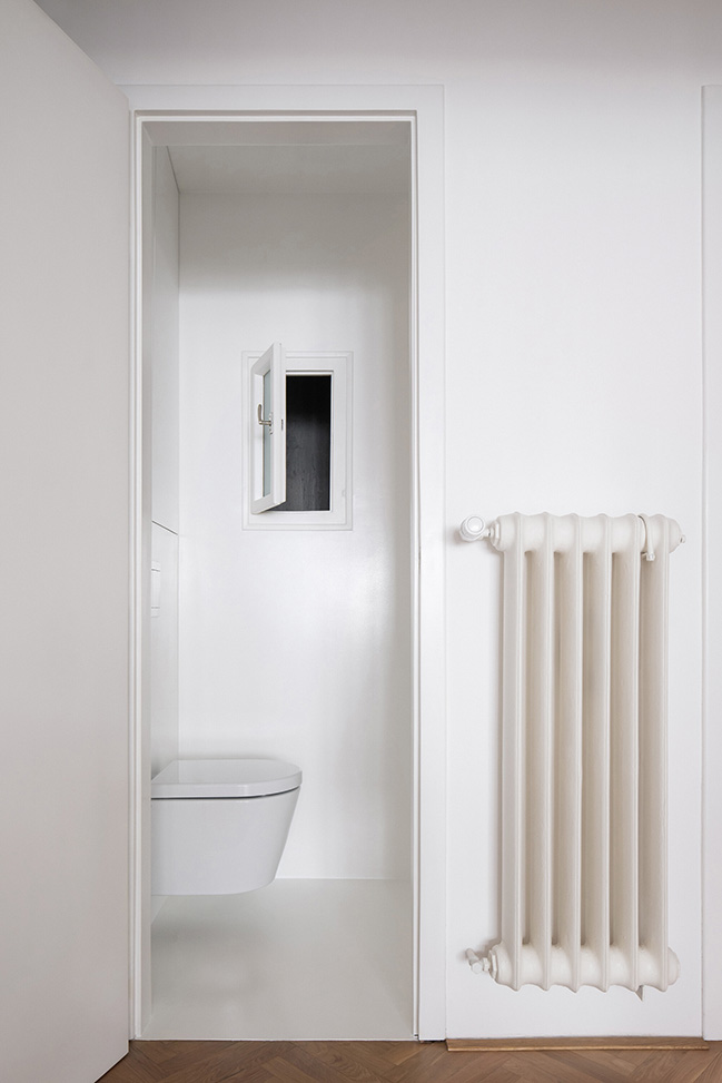 Functionalist Apartment with Pink Piggy by Martin Cenek Architecture