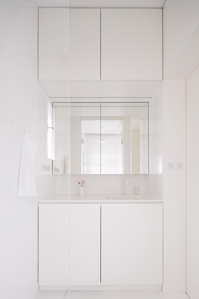 Functionalist Apartment with Pink Piggy by Martin Cenek Architecture